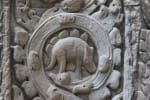 Close-up of what appears to some to be a stegosaurus on the carved relief adjacent to one of the many doors of the Ta Prohm temple. 